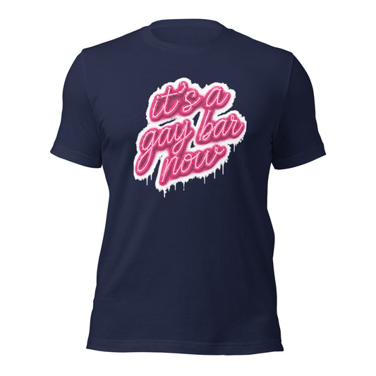 Navy blue t-shirt with pink text 'it's a gay bar now' on a white background